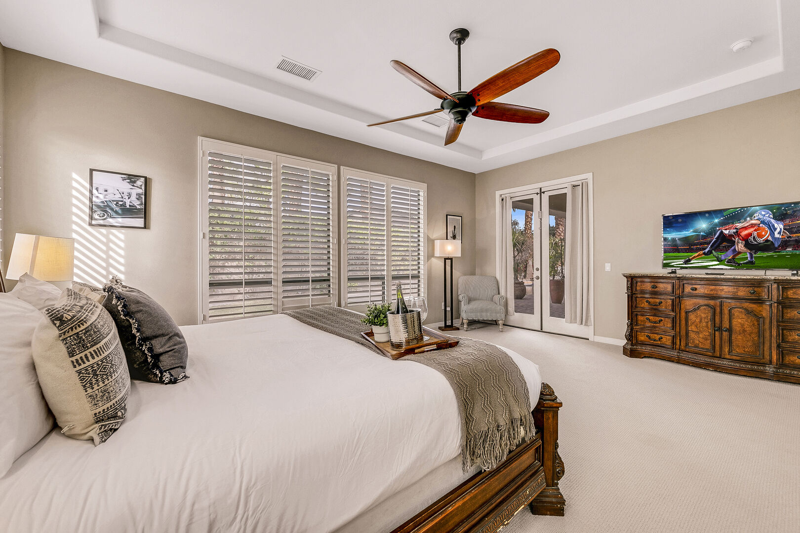 This master bedroom features a LARGE walk-in closet with access to the back patio.