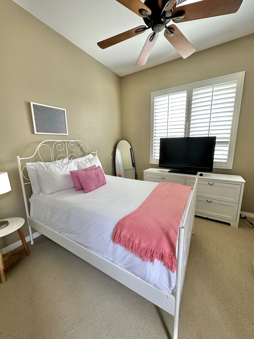 Attached Casita Suite 4 is accessible through front courtyard and features a Full-sized Bed, 43-inch Dynex Smart television, switch-controlled ceiling fan, and reach-in closet with access to the front courtyard.