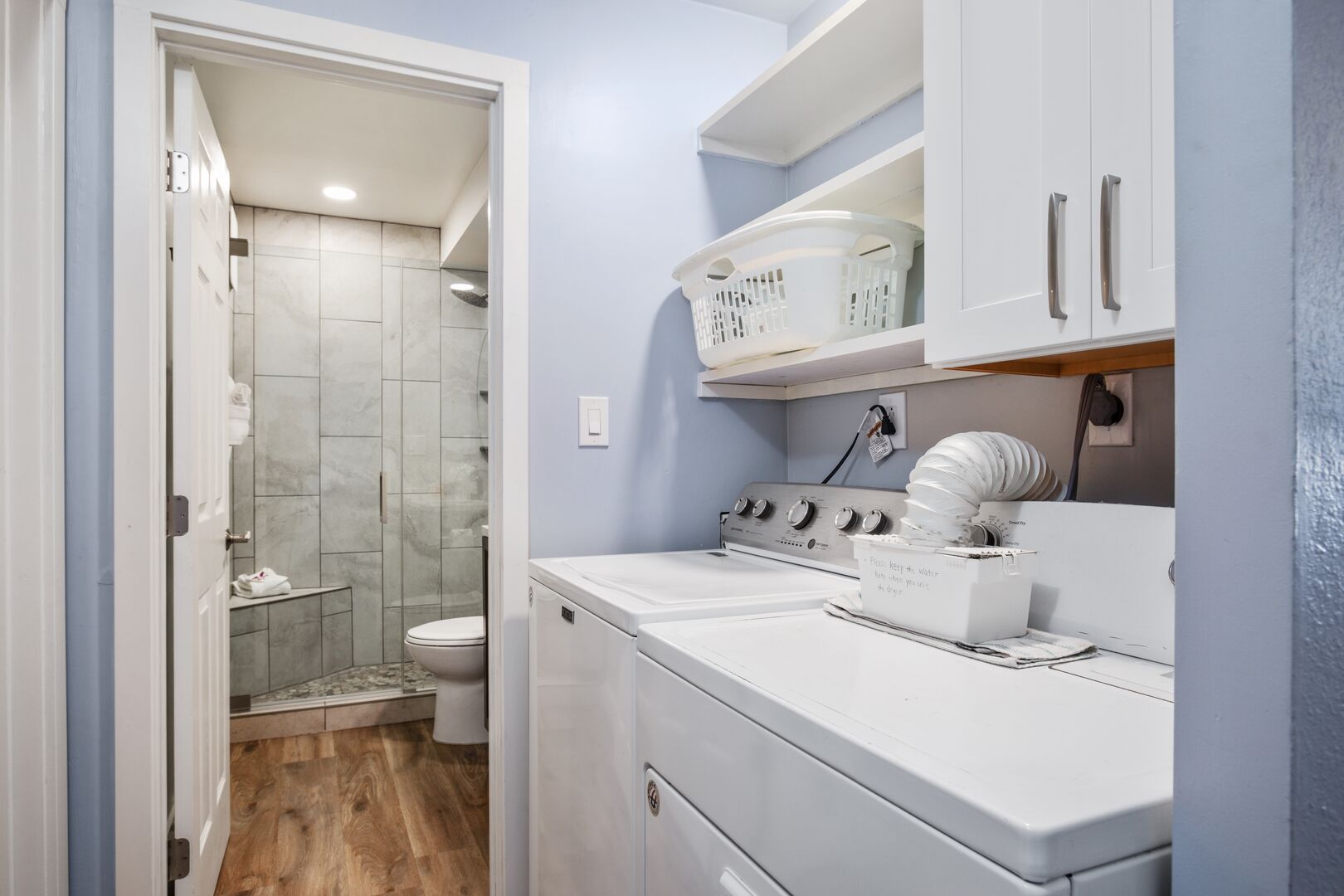 Full bathroom with walk-in shower and own washing machine and dryer. Full bathroom with walk-in shower and own washing machine and dryer.