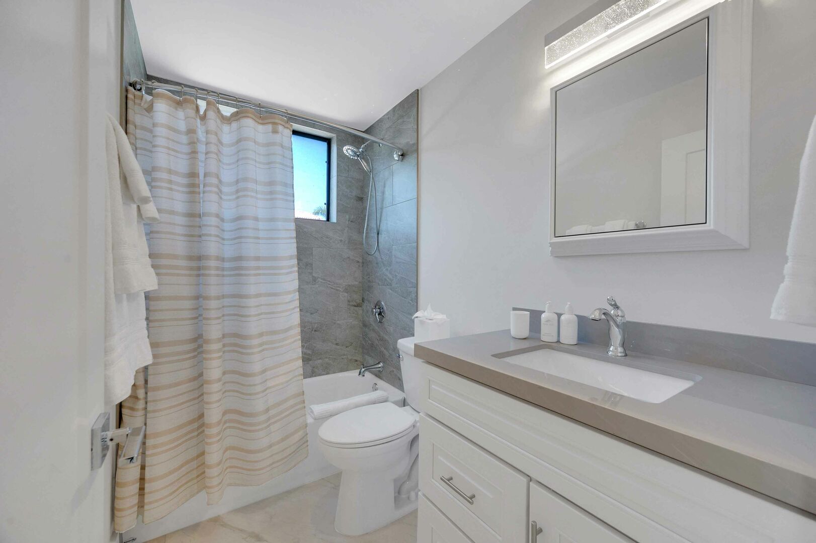 The full bathroom is nicely located between bedroom three and four, featuring a shower tub combo.