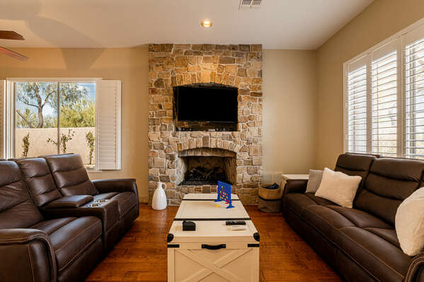 Living Room with Reclining Sofa Seating, Stone Gas Fireplace and Smart TV