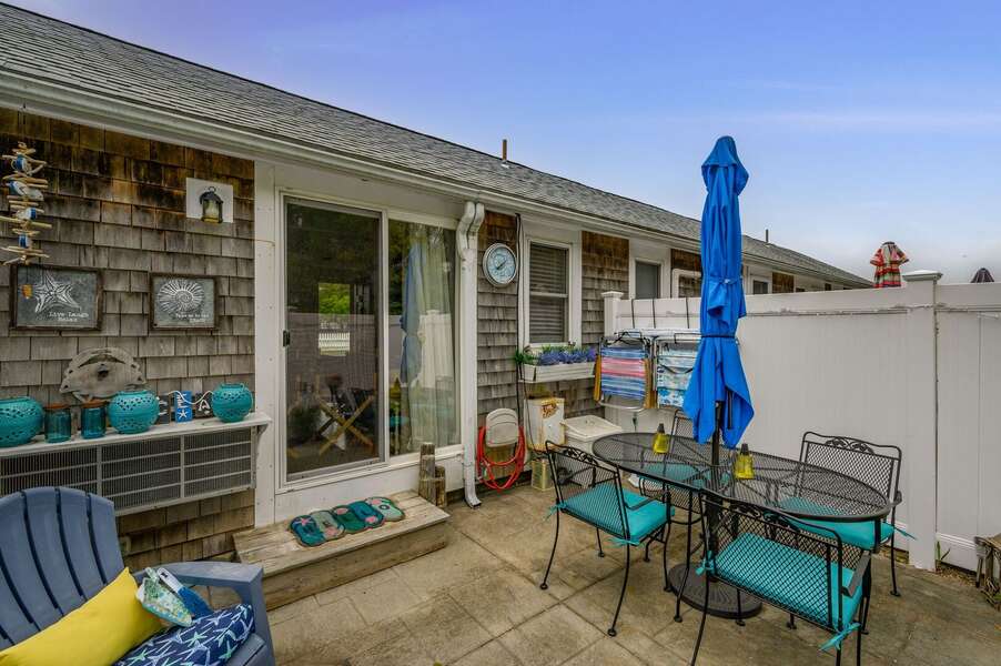Private patio with table and umbrella for outdoor dining - 194 Captain Chase Road Dennis Port