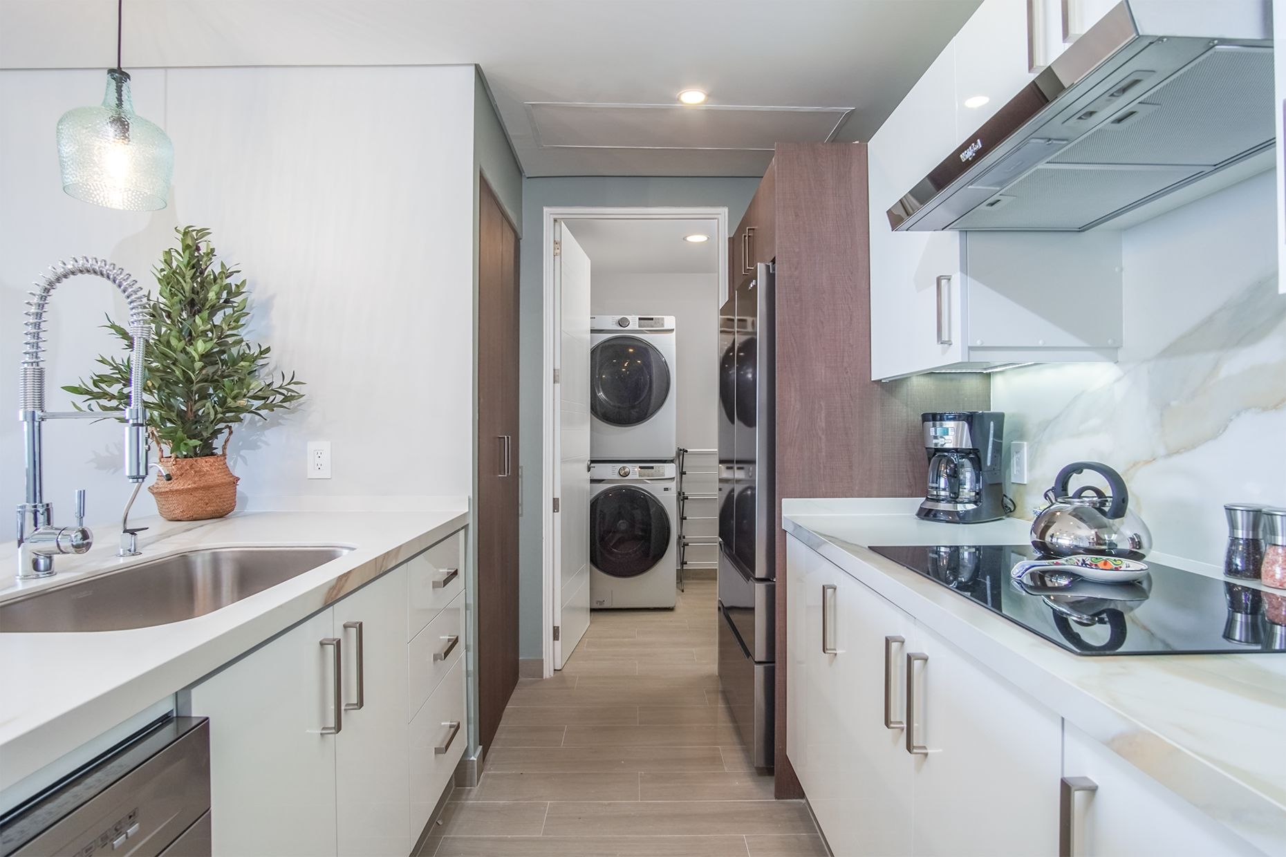 the entire kitchen is well laid out and complete, with washer and dryer in an attached utility room