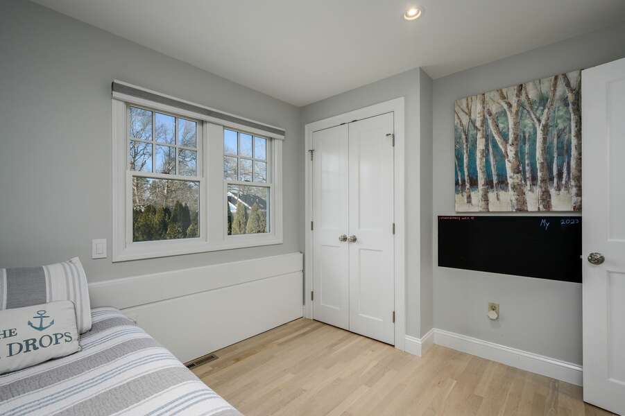 Bright Twin trundle bedroom with closet and chalkboard to leave notes about your vacation adventures - 176 Sudbury Lane Hyannis Cape Cod - Family Tides - NEVR