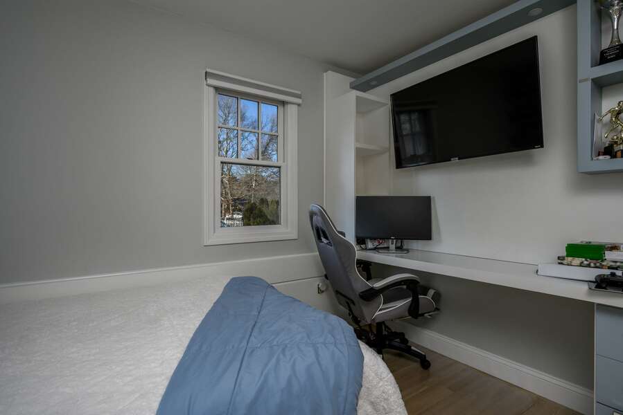Full bedroom with built in desk, flat screen TV and gaming chair - 176 Sudbury Lane Hyannis Cape Cod - Family Tides - NEVR