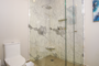 glass shower stall in the master bathroom