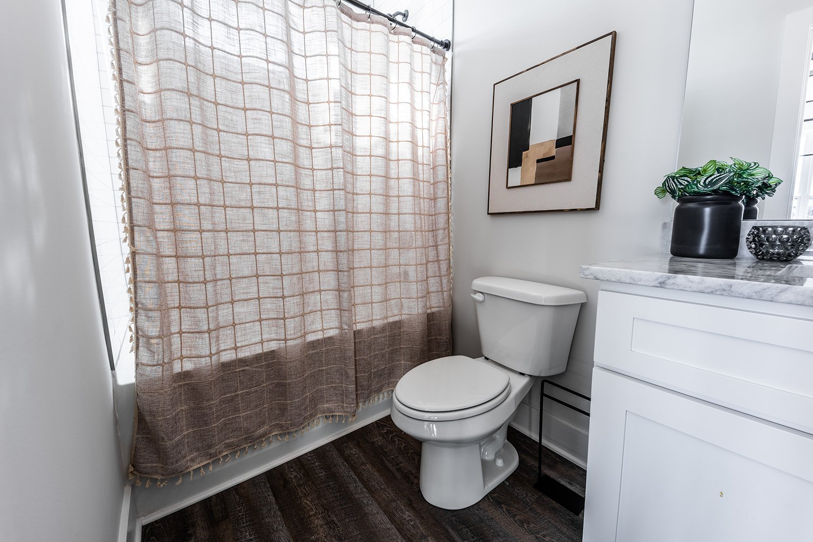 Unit 1: 2nd Bedroom En-Suite Full Bathroom featuring single vanity and shower/tub combo. (3rd Floor)
