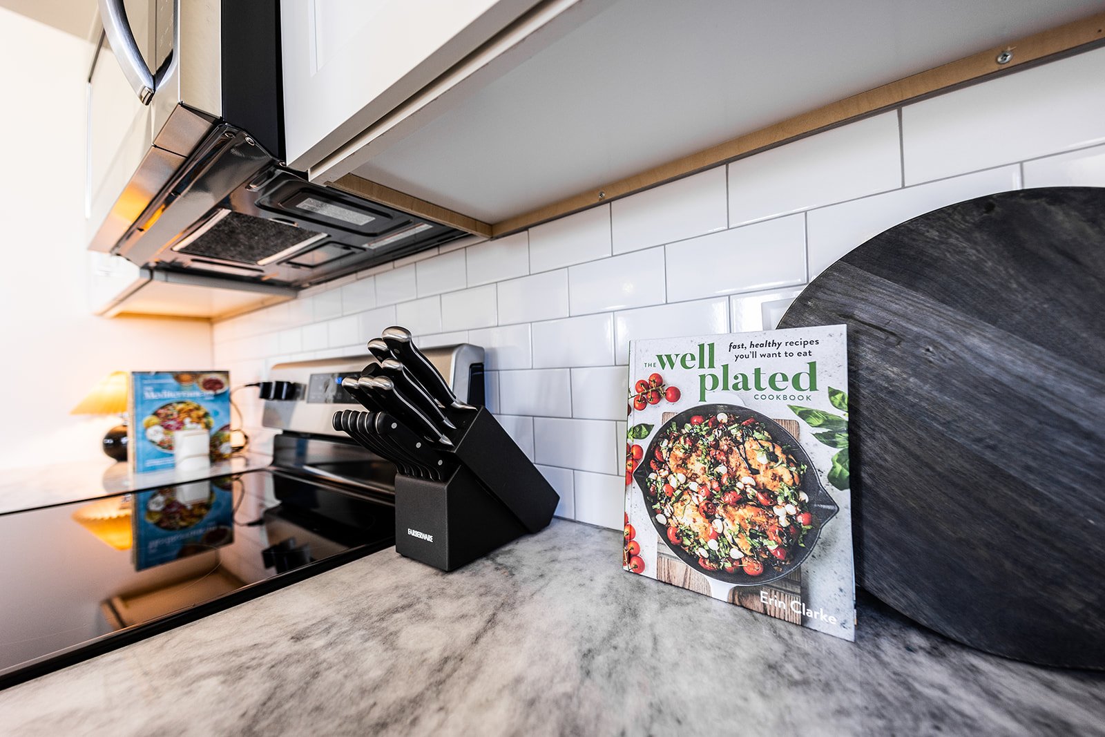 Unit 2: Fully equipped kitchen stocked with your basic cooking essentials. Complete with stainless steel appliances and breakfast bar seating. (2nd floor)