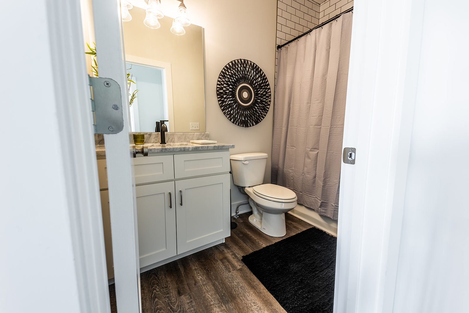Unit 2: 3rd bathroom featuring a single vanity and shower/tub combo. (2nd floor, hallway bathroom)