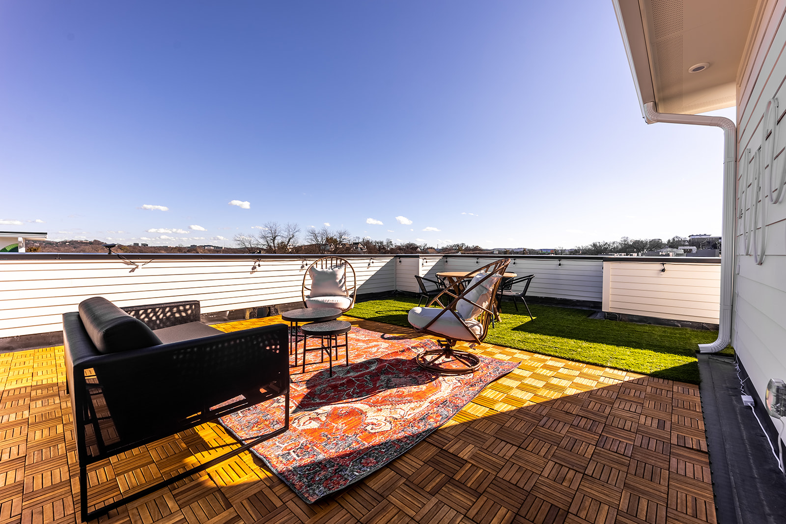 Unit 2: Private rooftop deck with lounge area, and outdoor dining. (4th floor)
