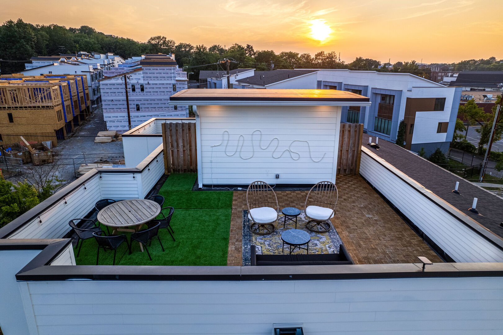 Unit 2: Private rooftop deck with lounge area, and outdoor dining.
