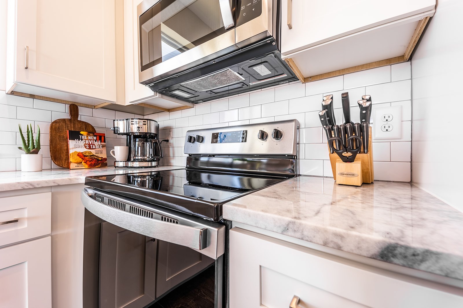 Unit 1 - Fully Equipped Kitchen stocked with your basic cooking essentials and stainless-steel appliances. (2nd Floor)
