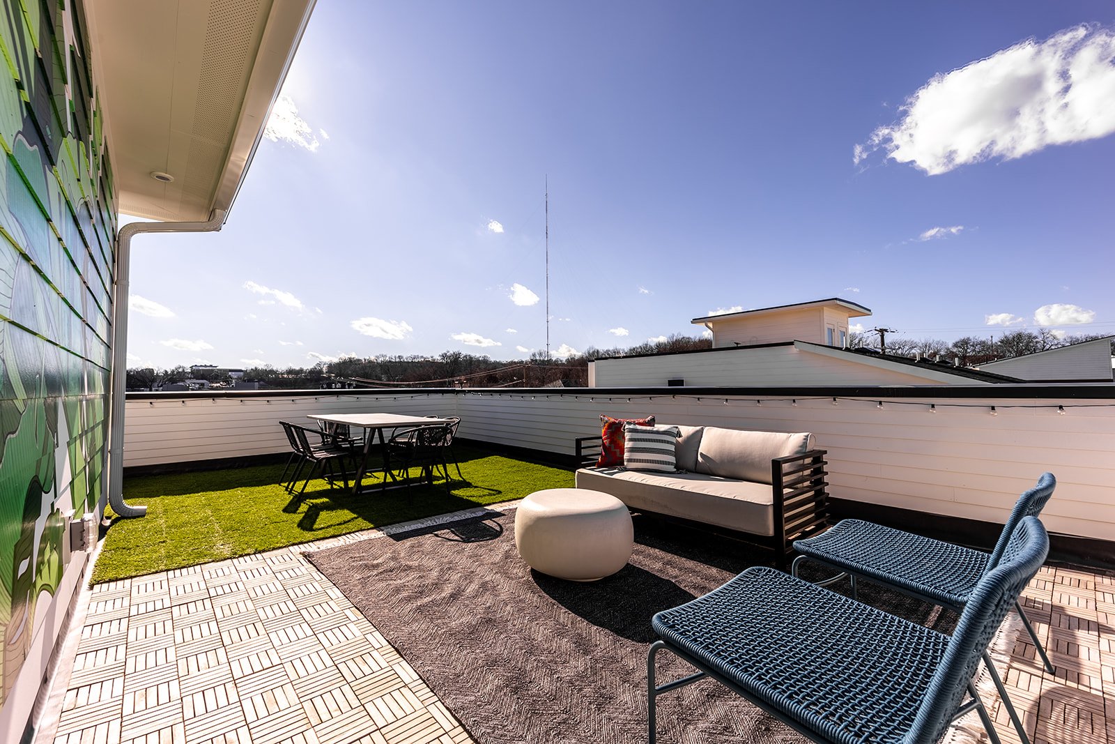 Unit 1 - Rooftop Patio with Photo Mural and outdoor seating/dining. (4th Floor)