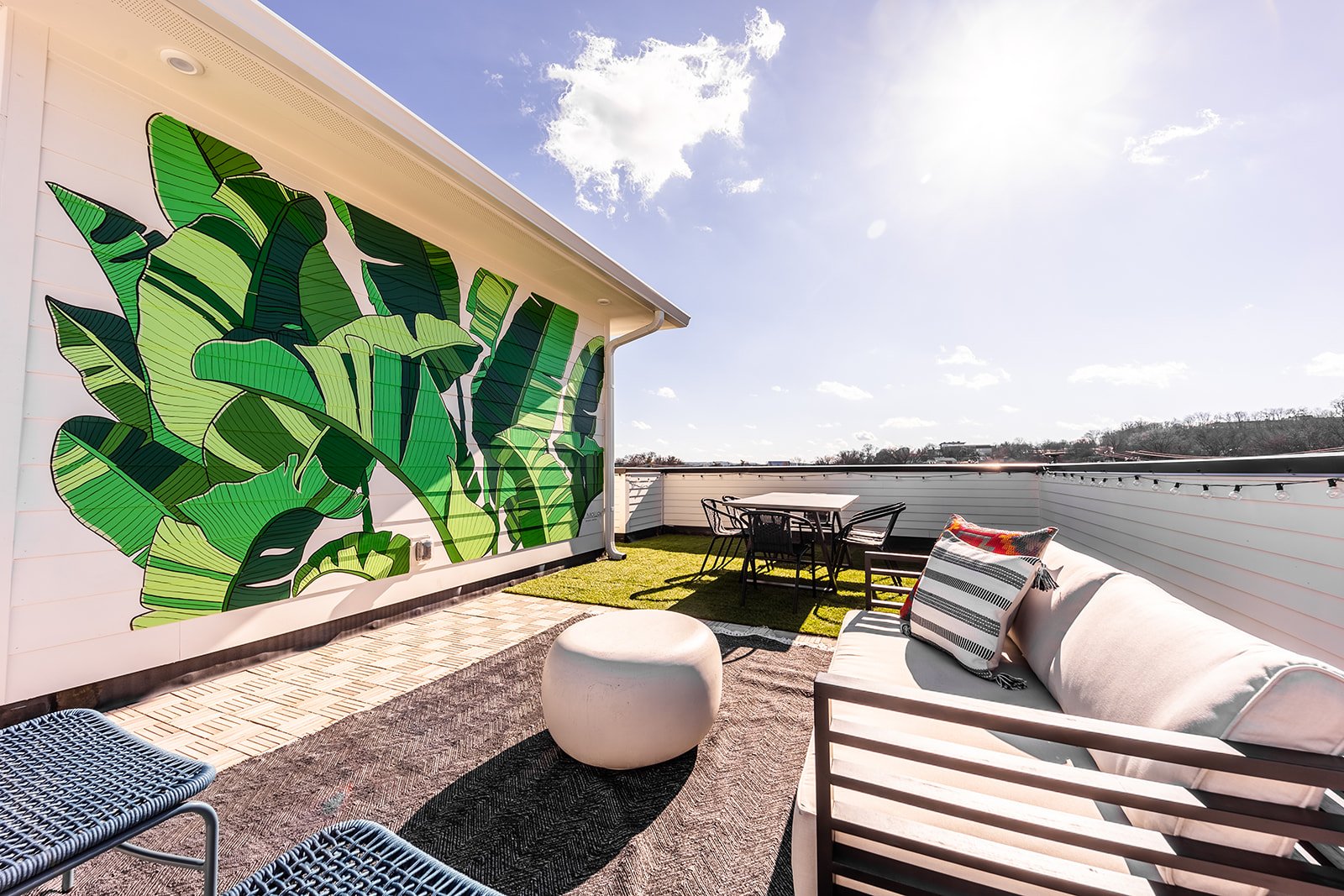 Unit 1 - Rooftop Patio with Photo Mural and outdoor seating/dining. (4th Floor)