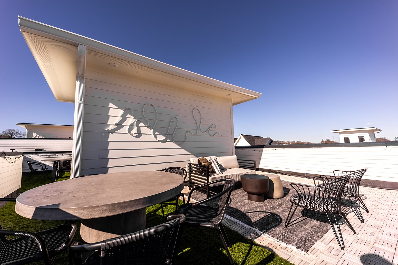 Unit 2 - Rooftop deck with lounge area, and outdoor dining.
