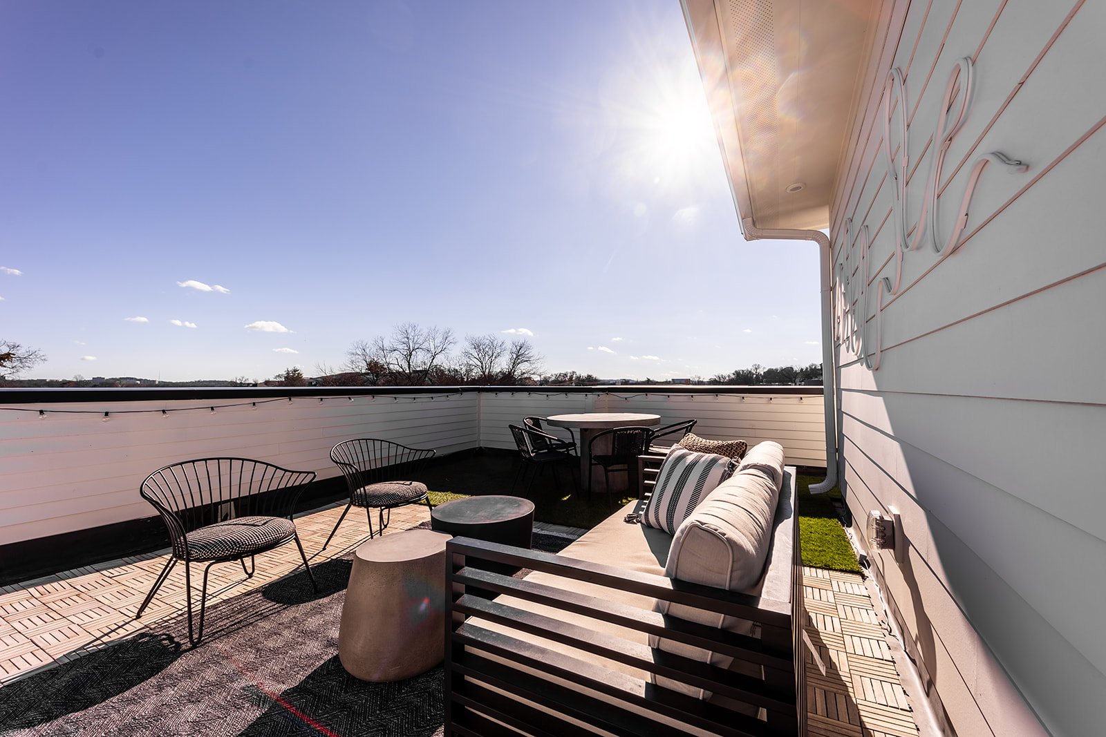 Unit 2 - Rooftop deck with lounge area, and outdoor dining.