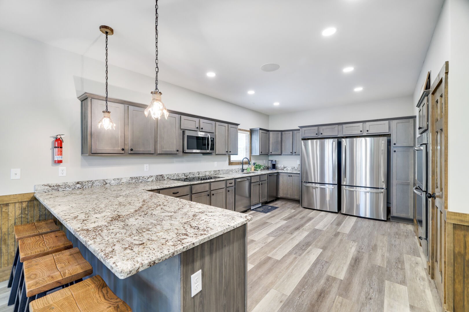 Double the Fun!
2 Refrigerators and 2 Ovens Means Plenty of Options for Cooking a Fantastic Meal in this Modern Kitchen. Taste Testers Will Be Ready for Treats at the Peninsula with Barstool Seating for 4.