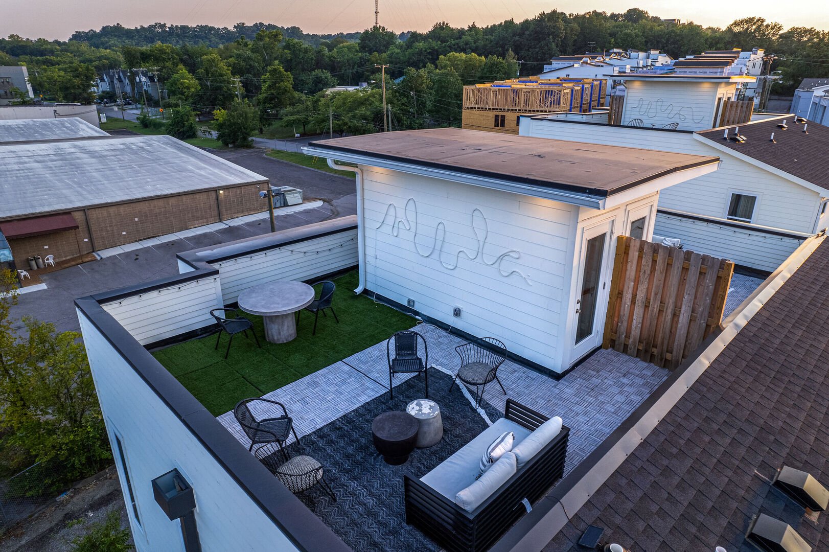 Unit 2: Private rooftop deck with lounge area, and outdoor dining.