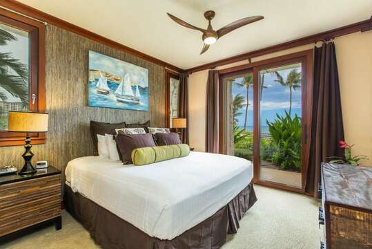 Primary Bedroom, with a King size bed, ceiling fan, and wall-mounted flat screen television