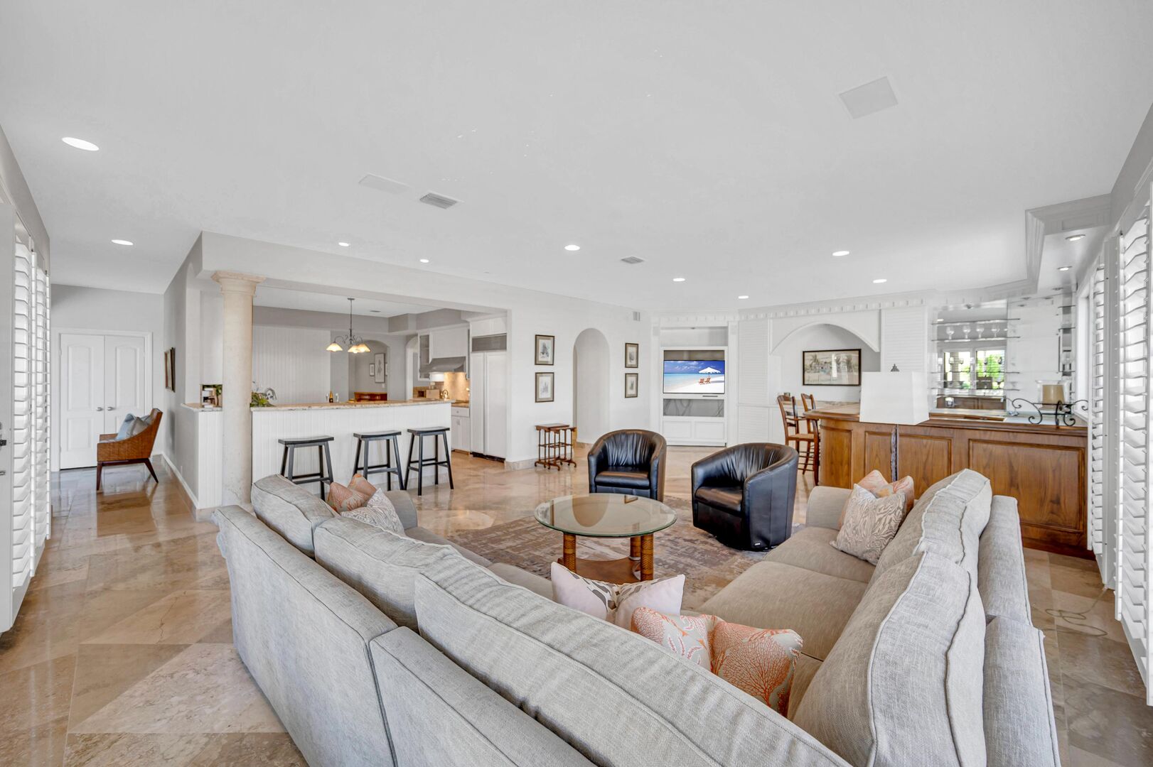 The family room also features a wet bar, smart TV and access to the heated pool.