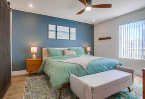 California king bed, ceiling fan and corner bay views from the master bedroom!