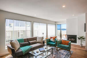 Indoor gas fireplace adds to the ambiance along with the corner bay front view!
