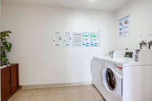 Communal laundry room with coin-operated washer and dryer, trash and recycling chutes on every floor.