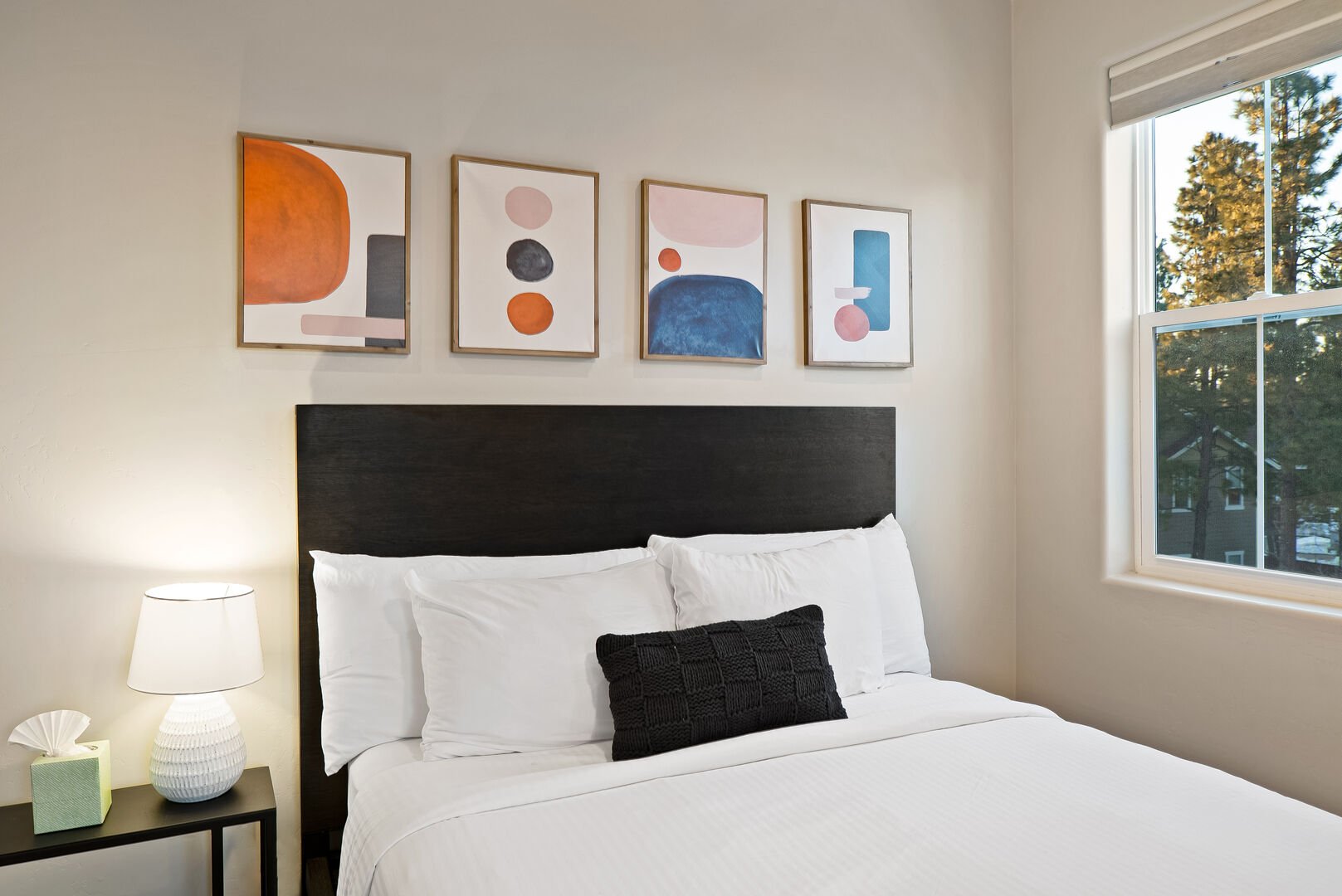 Geometric shapes and comfort in this upstairs guest bedroom.
