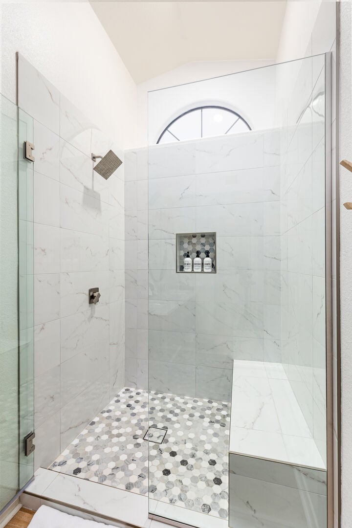 Walk in Master shower with seating.