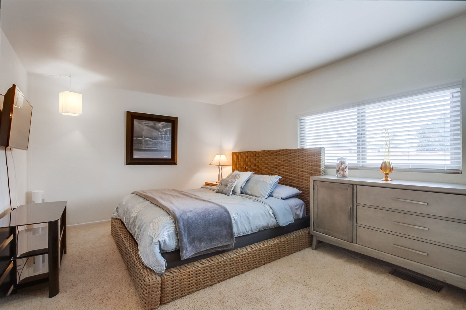 Upper level master bedroom with king size bed, dresser storage, large walk-in closet, smart TV with streaming and in-suite full bathroom