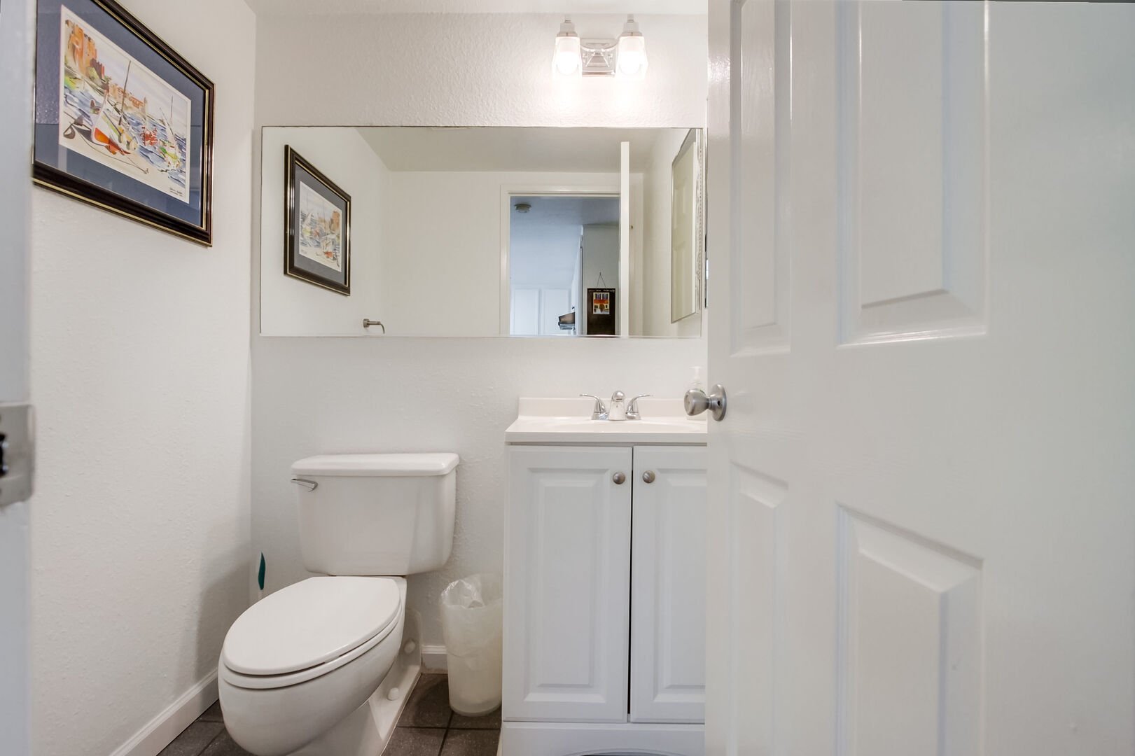 Separate lower level half bathroom (no tub or shower)
