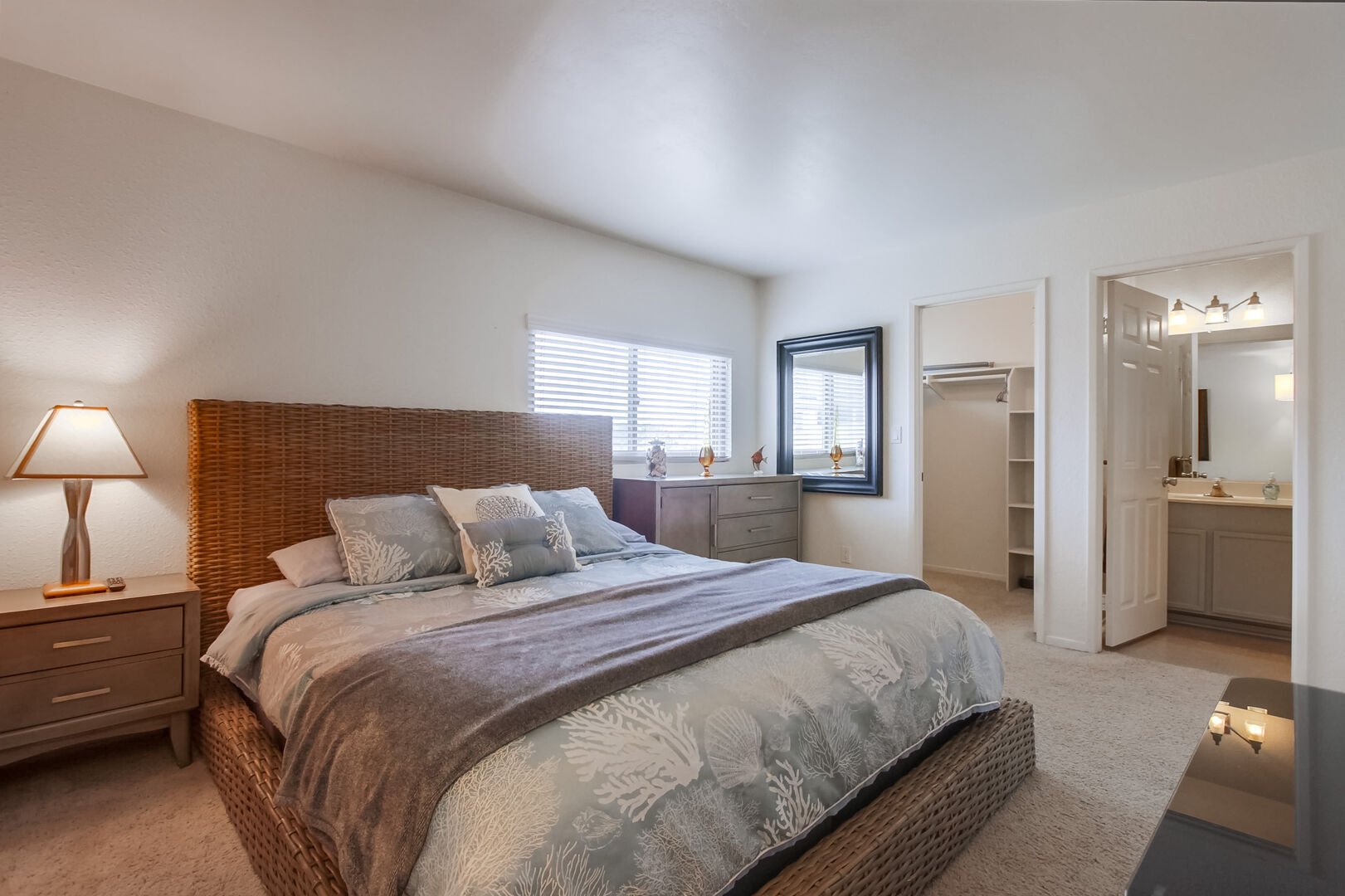 Upper level master bedroom with king size bed, dresser storage, large walk-in closet, smart TV and in-suite full bathroom