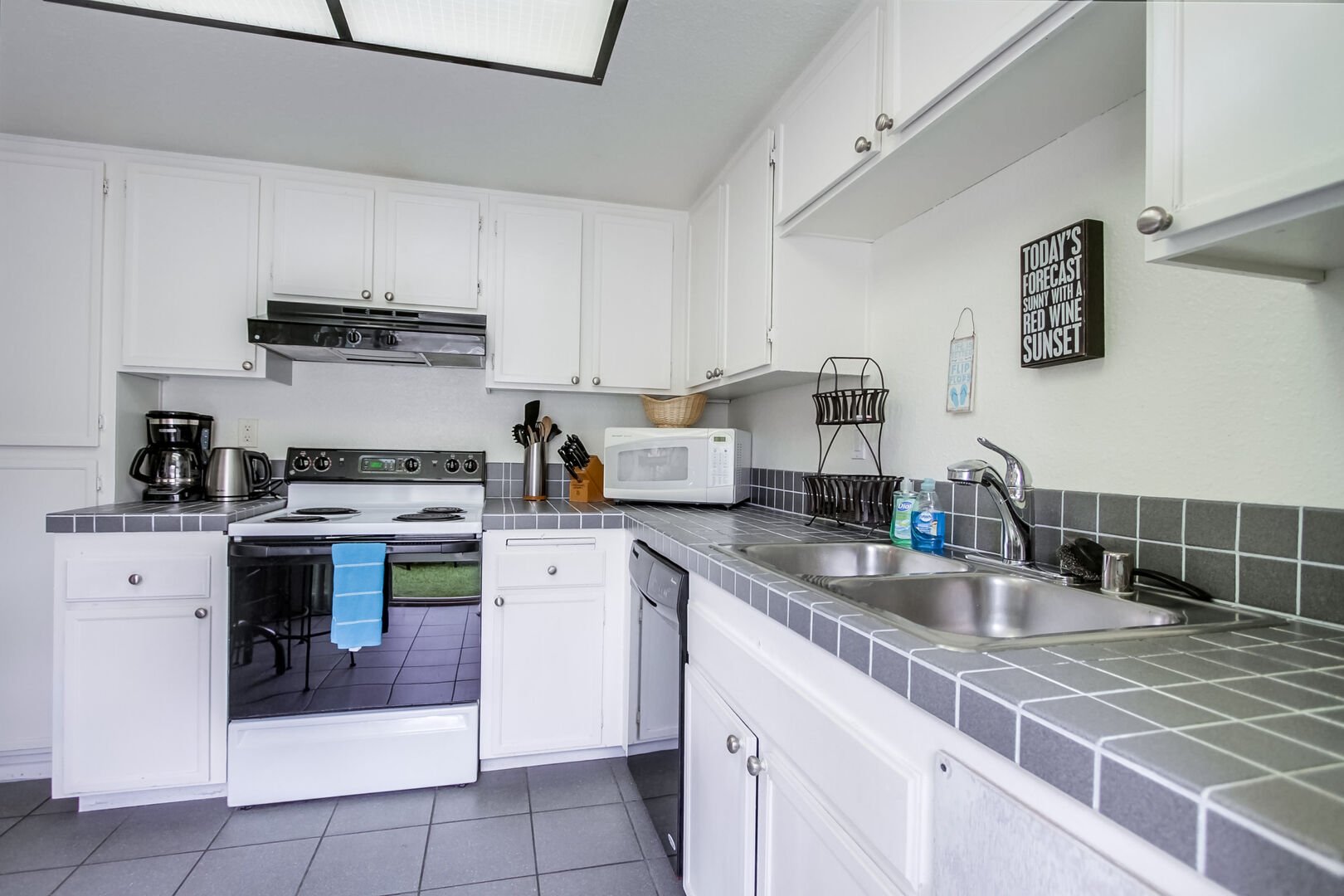 Plenty of room to prep meals in the kitchen and the ease to access the patio with propane grill!