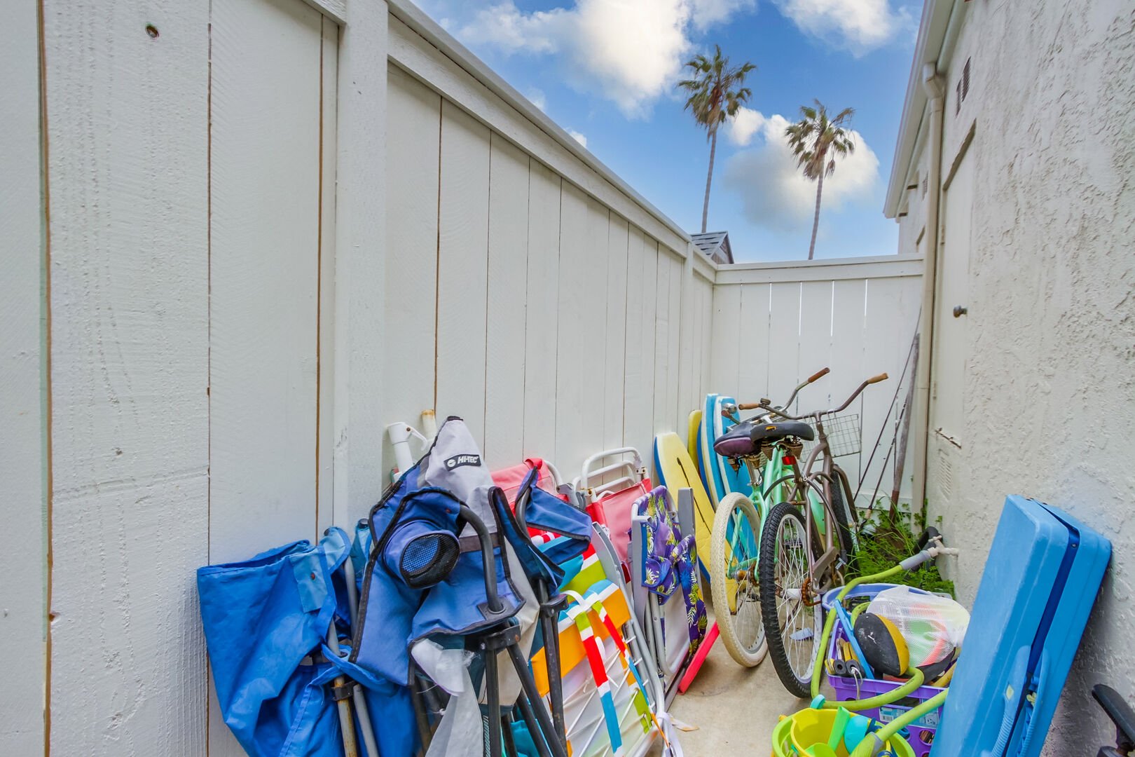 Bikes and beach accessories including boogie boards, beach chairs, sand toys, beach umbrella, etc