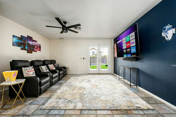 Sit back and watch tv in the entertainment movie style room.