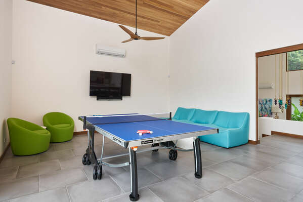 Inside the game room you'll find the ping pong table that's all set for you to have a blast.