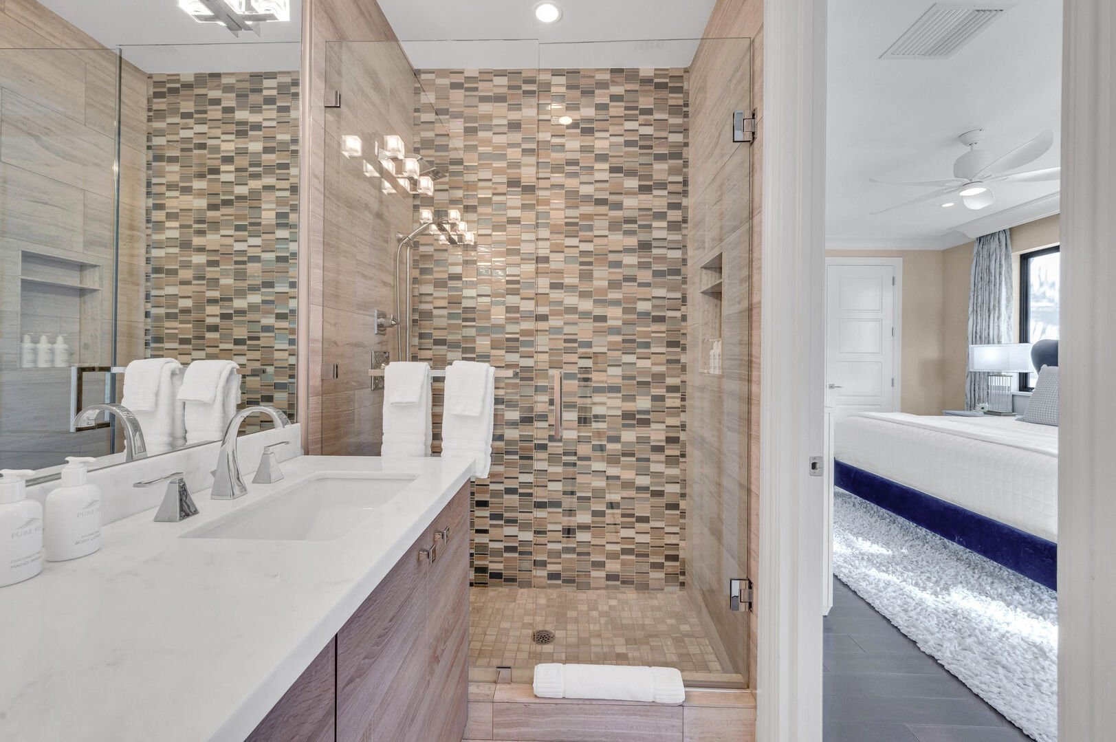 The third bedroom's bathroom features a walk-in shower.
