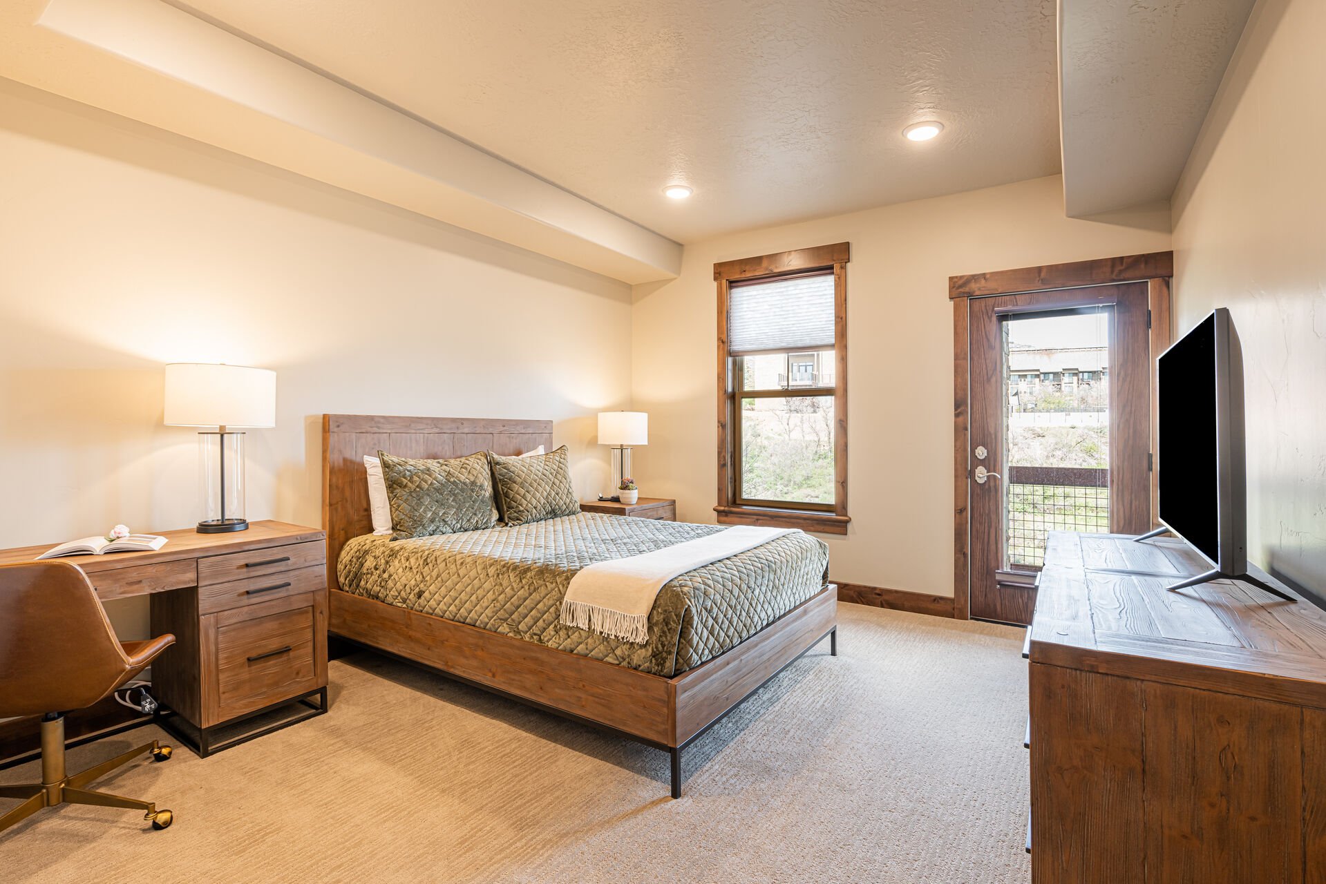 Master Bedroom with a Queen Bed and Deck Access