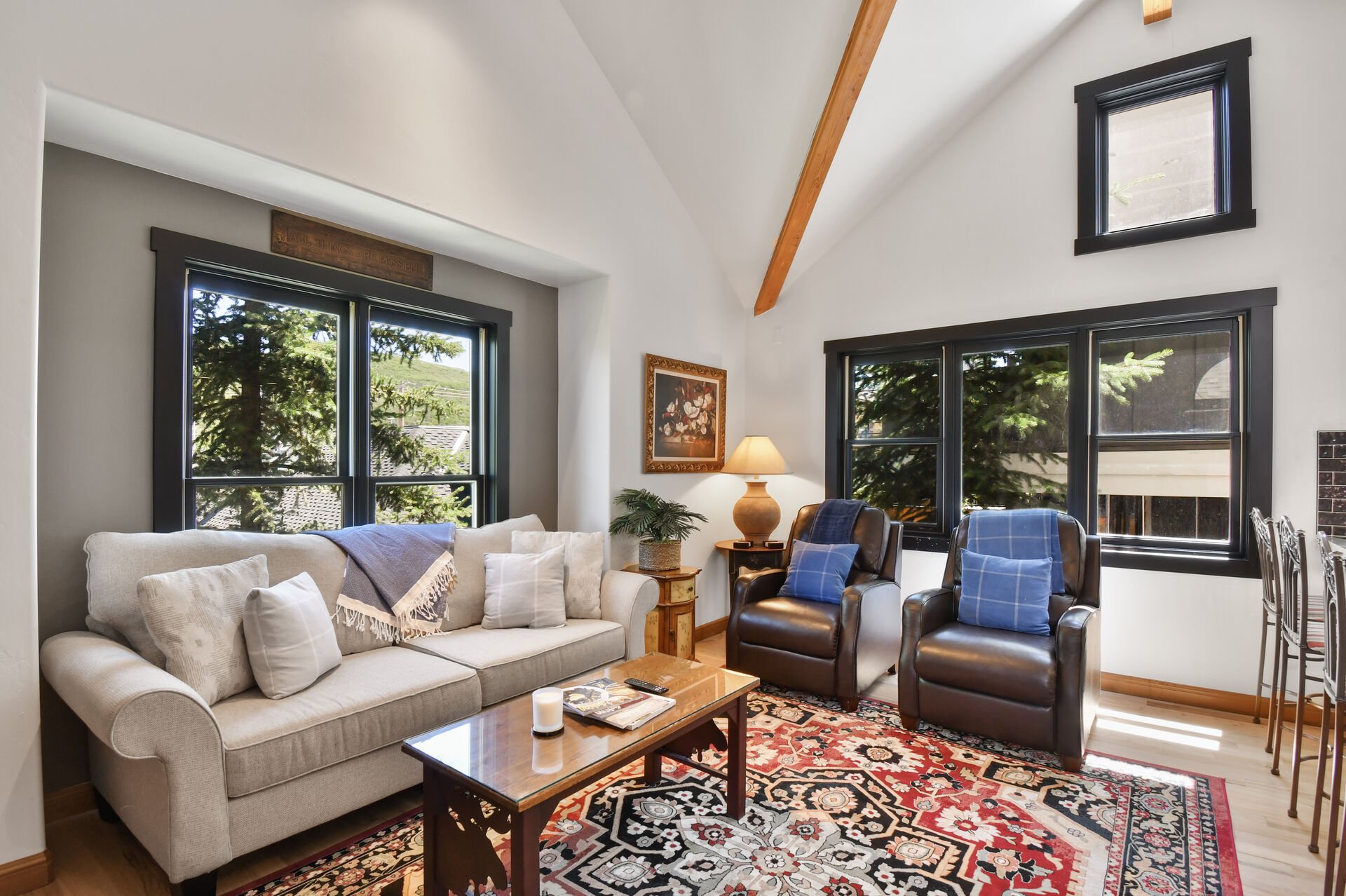 Living room with windows and gorgeous vaulted ceiling