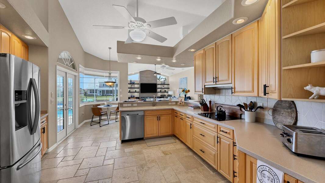 Bright kitchen overlooks the water and the family room