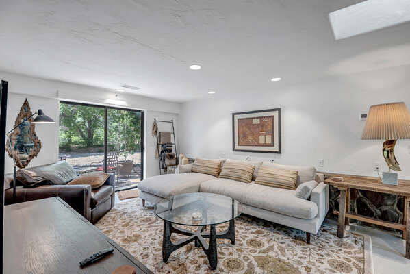 Secondary Living Room with Sectional Seating, Smart TV and Backyard Access