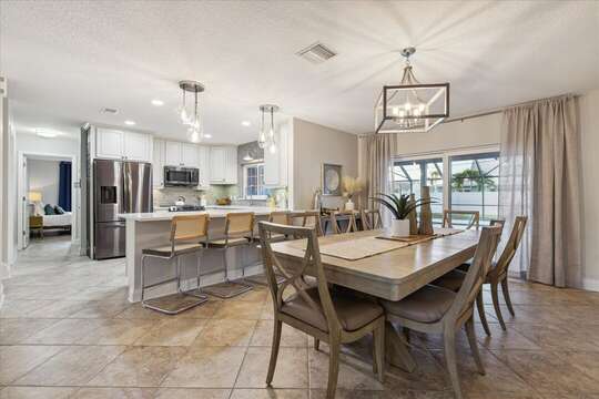 Open kitchen and dining area, patio doors to the pool