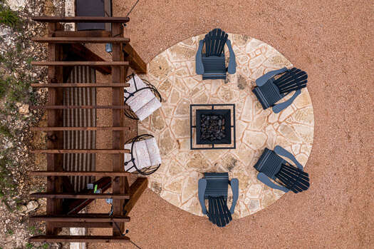 Gather around the fire pit with seating for six