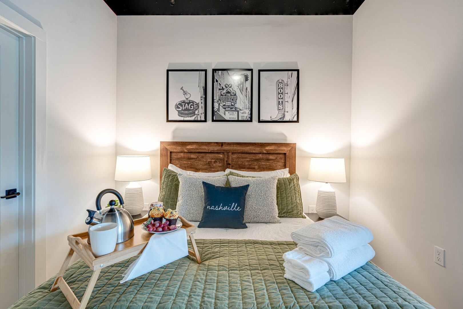 Primary Bedroom featuring a Queen size bed, flat-screen SMART TV and Nashville themed designer furnishings.