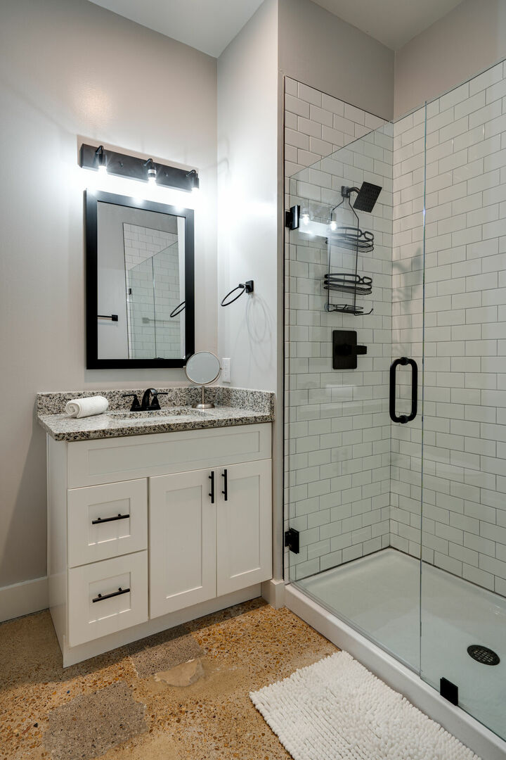 Primary Bathroom featuring single vanity and stand-in shower.