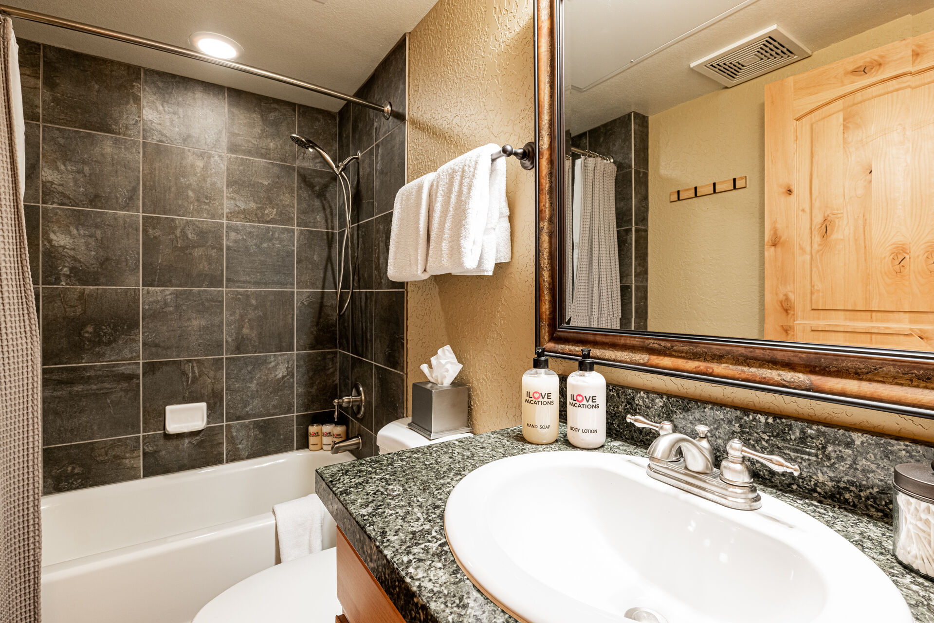 Upper level master bedroom en suite bathroom with tub/shower combo