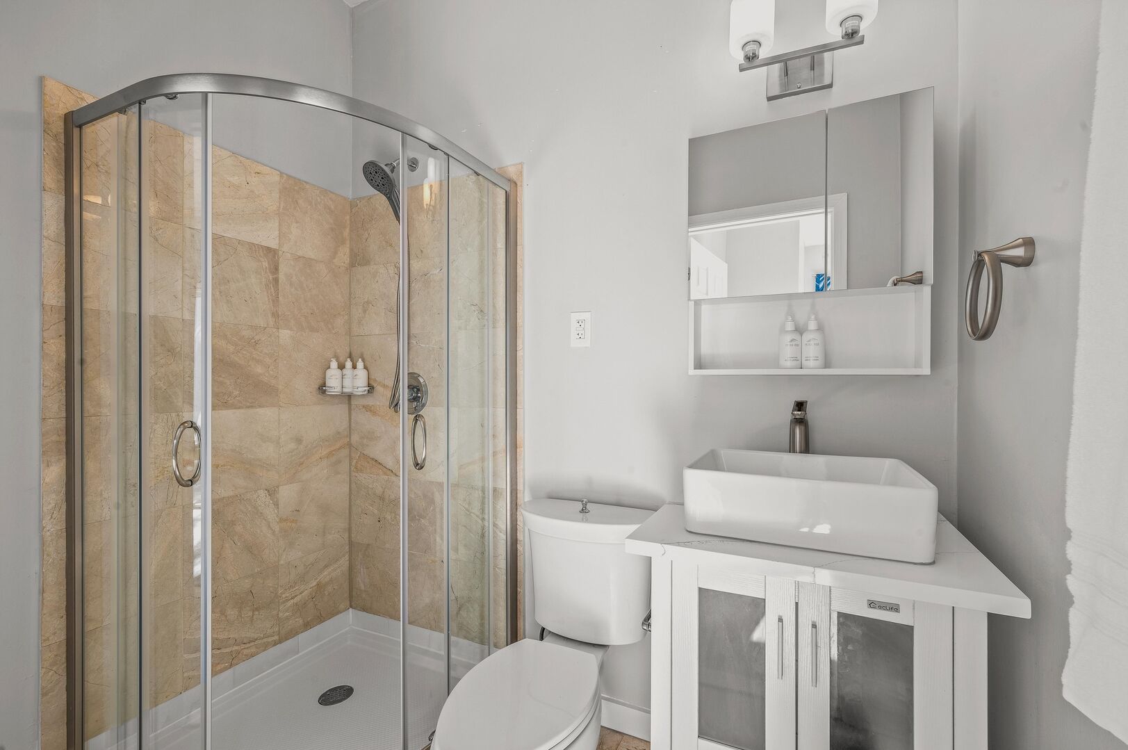 The third bathroom has a full shower and spa like amenities.