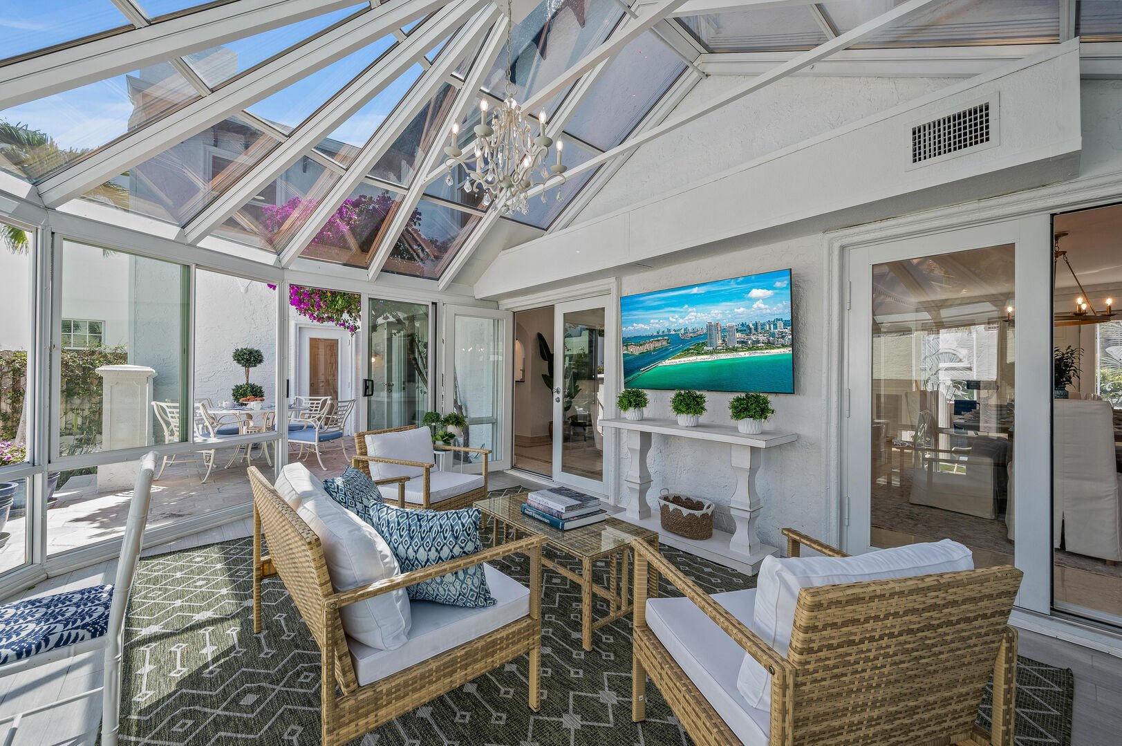 Basking in the warmth of the sunroom, where relaxation and natural light come together in perfect harmony. Enjoy your day watching the smart TV.