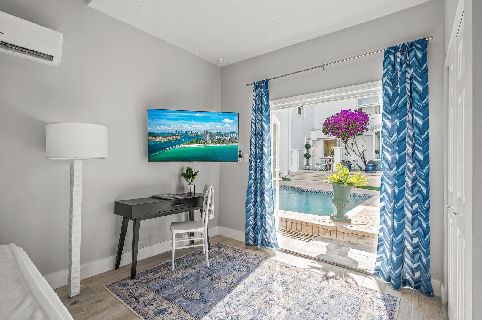 Soak in the views of the heated pool from the fourth bedroom while you're watching the smart TV.