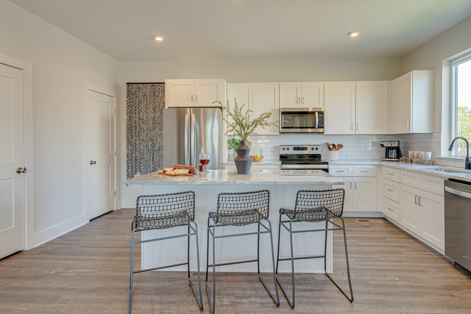 2nd floor: Fully equipped kitchen stocked with basic cooking essentials and stainless steel appliances.